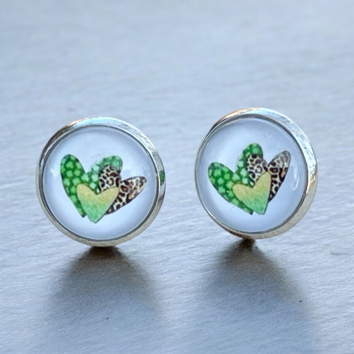 Silver Stud Earrings: Patterned Heart Design