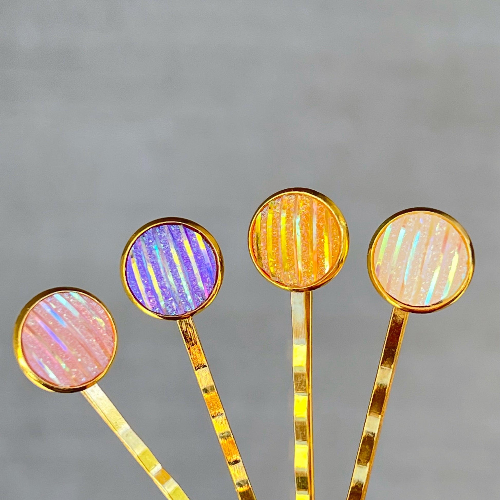 Set of 4 Gold-Toned Hair Pins: Vibrant Accents in Purple, Yellow, Pink, & White Striped Glitter Design