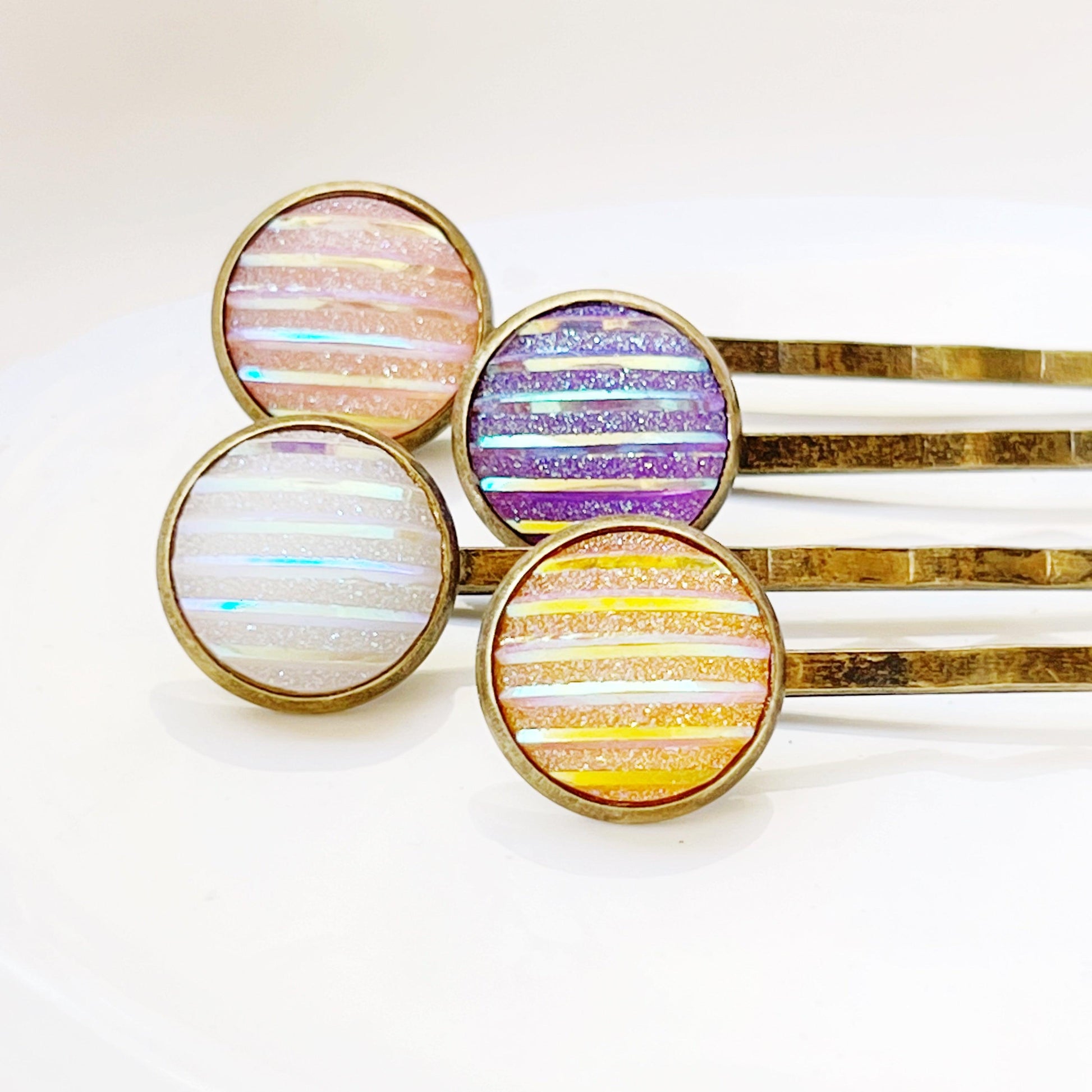 Set of 4 Brass-Toned Hair Pins: Vibrant Accents in Purple, Yellow, Pink, and White Striped Glitter Design