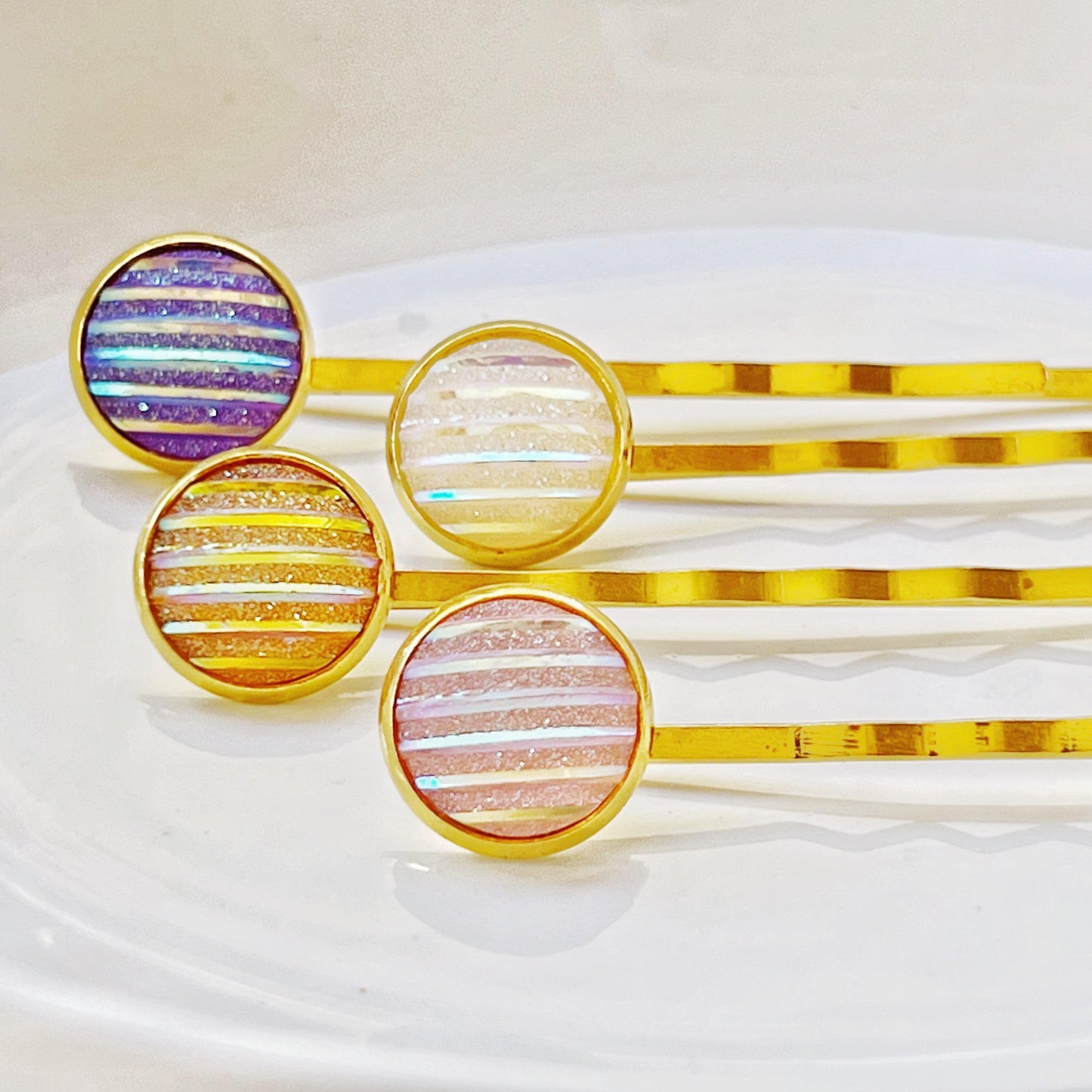 Set of 4 Gold-Toned Hair Pins: Vibrant Accents in Purple, Yellow, Pink, & White Striped Glitter Design