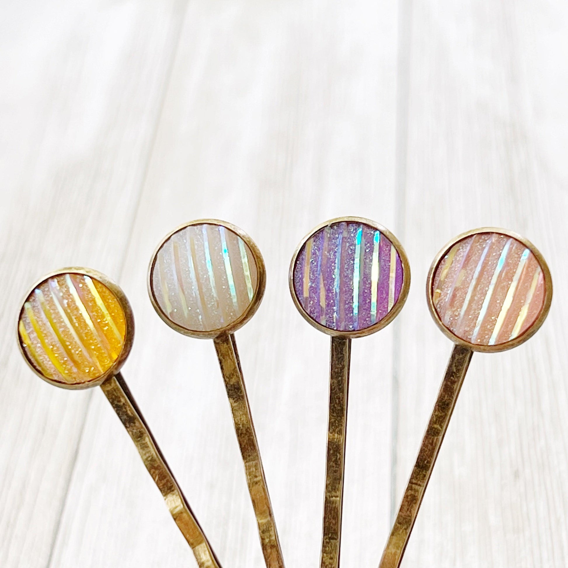 Set of 4 Brass-Toned Hair Pins: Vibrant Accents in Purple, Yellow, Pink, and White Striped Glitter Design