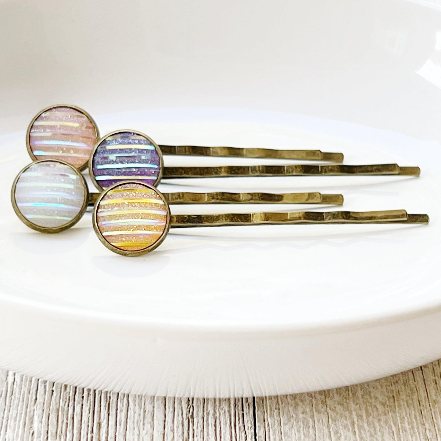 Set of 4 Brass-Toned Hair Pins: Vibrant Accents in Purple, Yellow, Pink, and White Striped Glitter Design