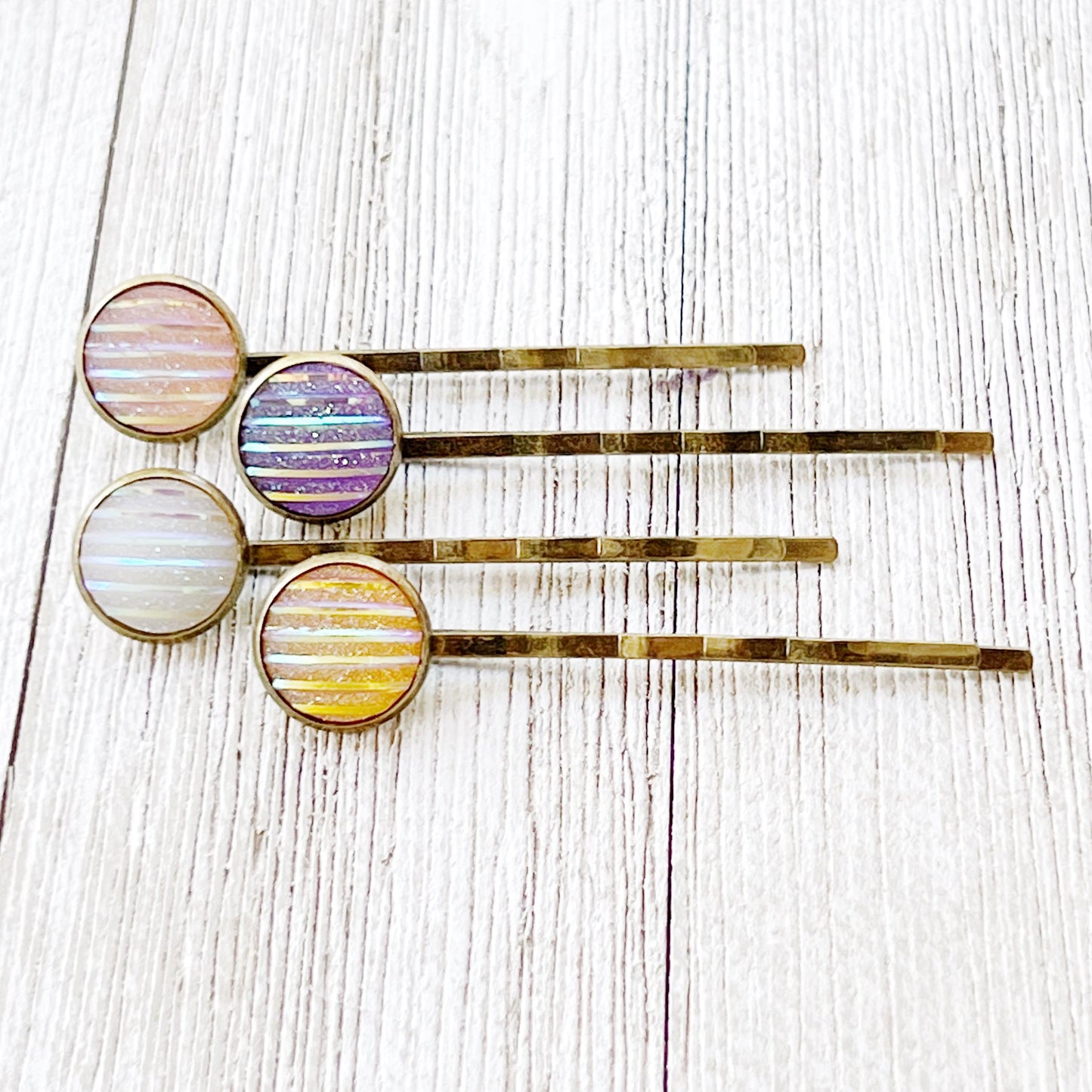 Set of 4 Brass-Toned Hair Pins: Vibrant Accents in Purple, Yellow, Pink, and White Striped Glitter Design